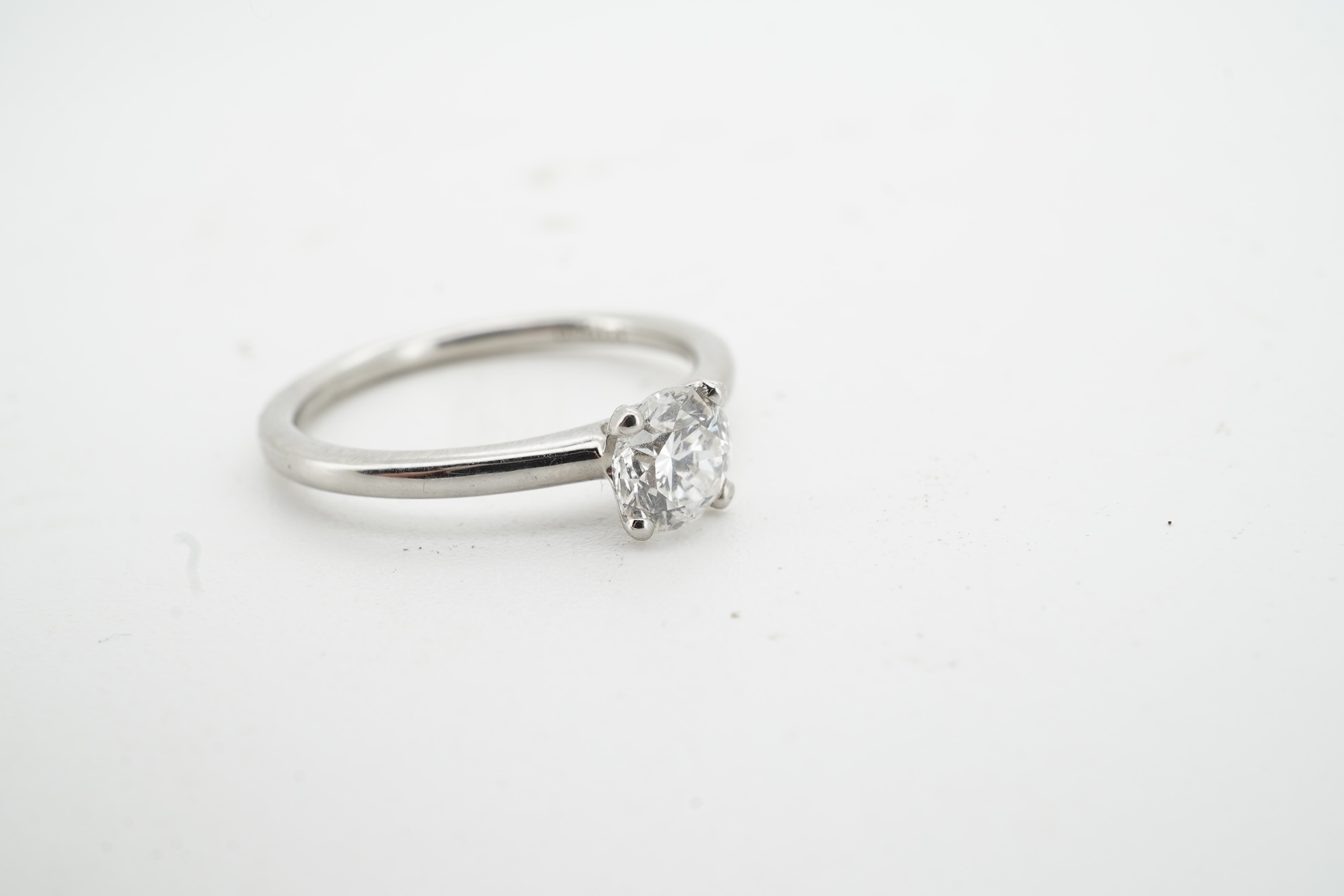 A diamond ring, claw-set with a brilliant-cut diamond weighing approximately 0.52 carats, mounted in platinum, size L1/2, British hallmarks, gross weight approximately 3 grams